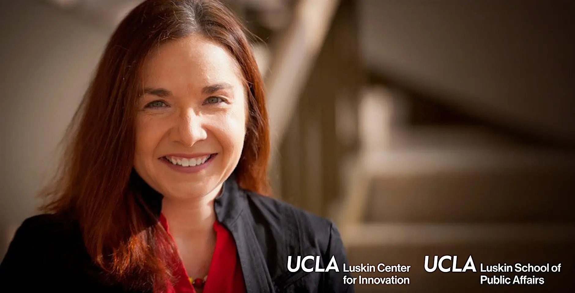 Wide rectangular photo, with red-brown-haired Caucasian woman on left with UCLA Luskin Center for Innovation and UCLA Luskin School of Public Affairs in white text at bottom right of image