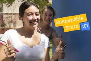 Two college-age female students in foreground and building and tree in background on left half of image, and text on right side of image "Sustainable Bruin 101"